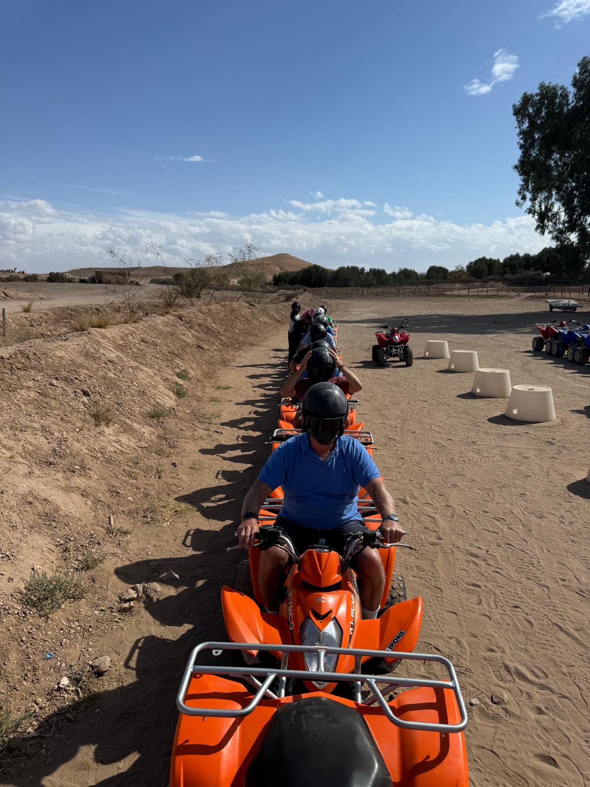 A line of quad bikes on the trail