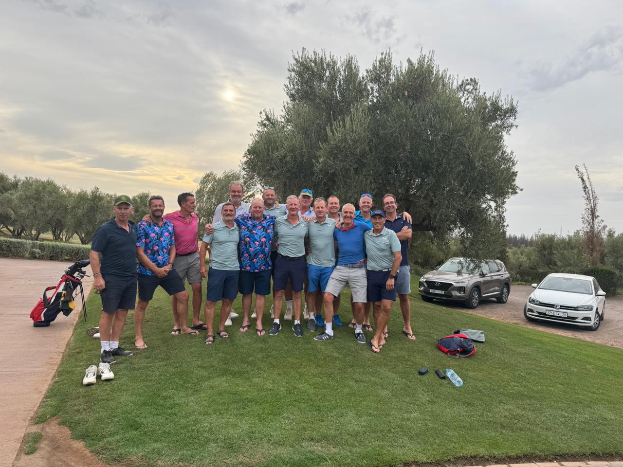 The group together beside the golf course