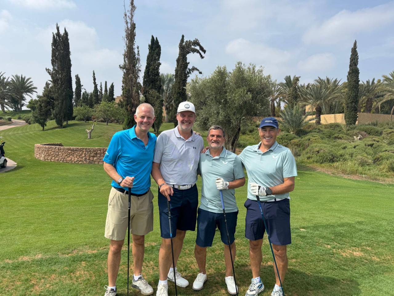 A fourball posing before their round