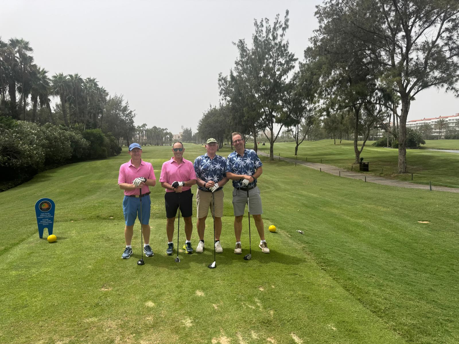 Four Reloaders on a tee in team shirts