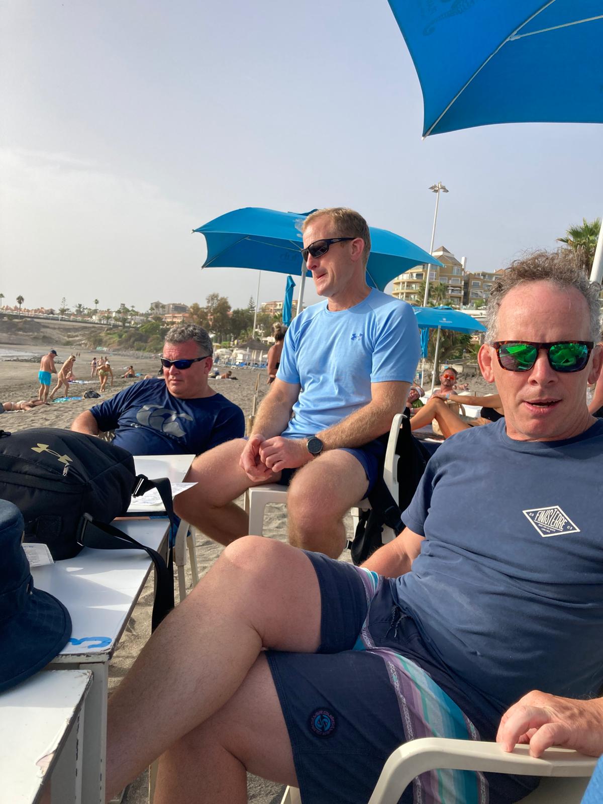 Three Reloaders having drinks by the beach