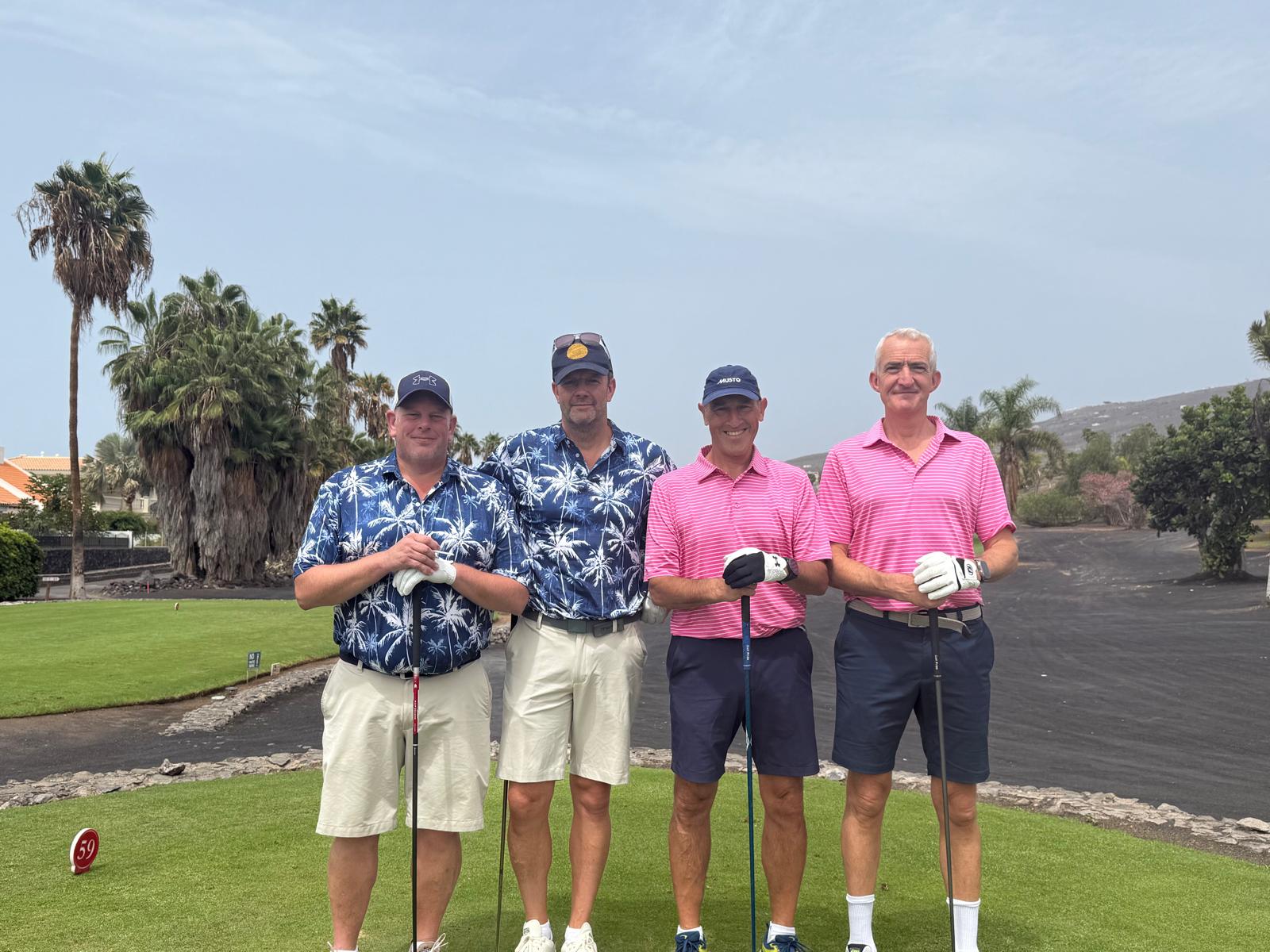 Four Reloaders in team shirts on the course