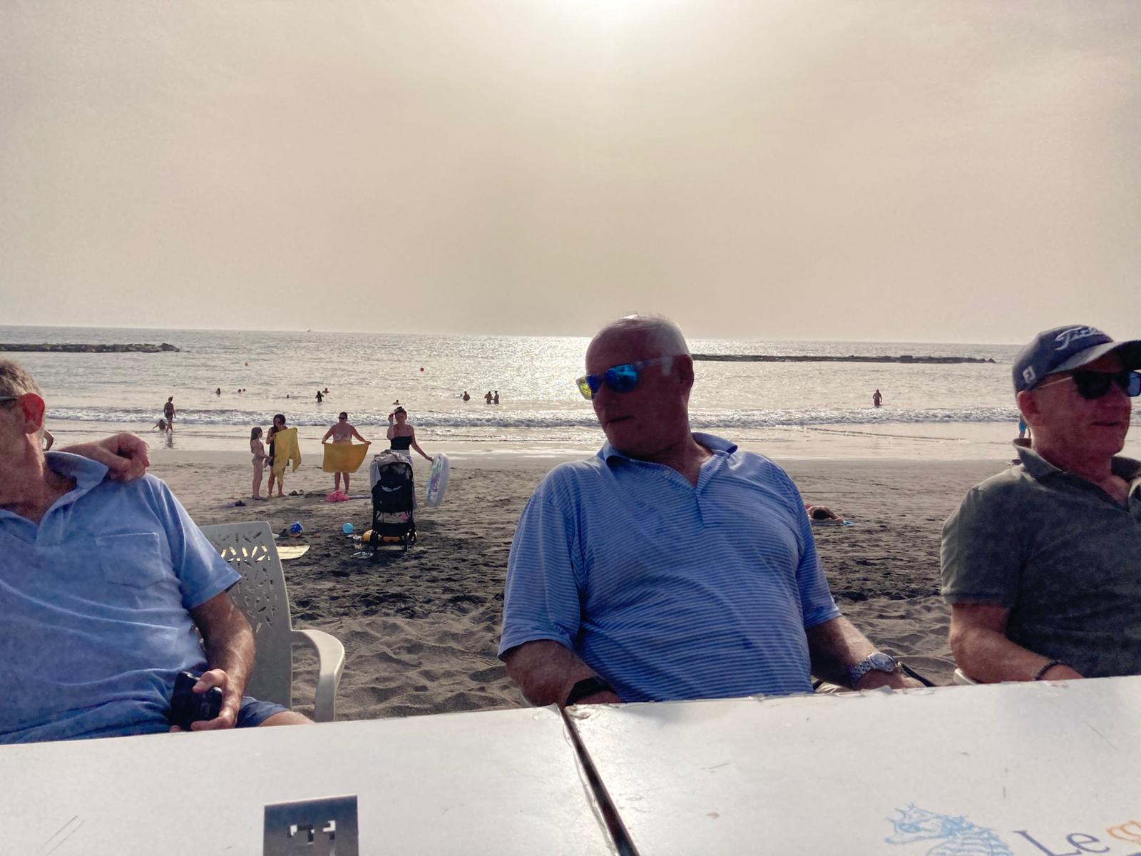 Reloaders gathered around a beachside table